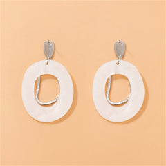 Chic white shell dangle earrings with silver-plated hooks, offering a modern touch to your jewelry collection.