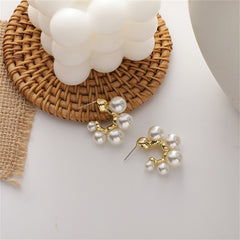Dazzling pearl cluster earrings with 18K gold-plated C-shape huggies, perfect for elevating your jewelry collection.