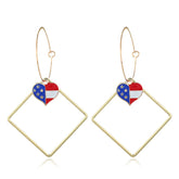Stunning heart-shaped earrings adorned with the American flag, ideal for showcasing your patriotic spirit.