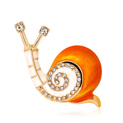 Stunning 18K gold-plated snail brooch featuring white accents and shimmering cubic zirconia, ideal for any jewelry collection.