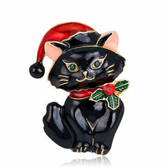 A chic black cat brooch adorned with a Santa hat, crafted in 18K gold-plated and sparkling cubic zirconia.