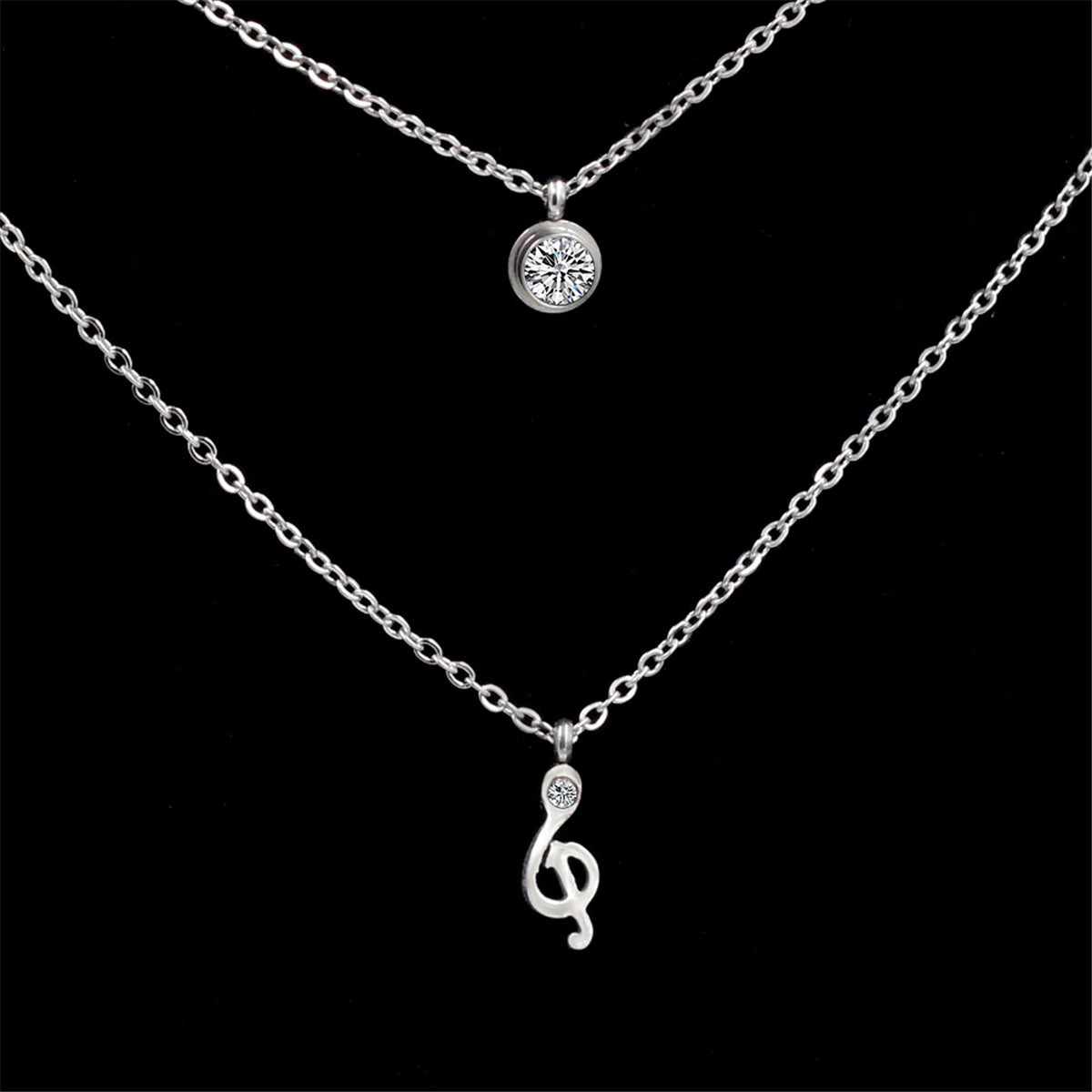 Cubic Zirconia and Silver-Plated Clef Note Layered Pendant Necklace, silver pendant necklace for women, detail close-up
