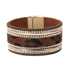 Elegant leopard print leather cuff bracelet featuring a gold-plated clasp, adorned with 18K gold plating and cubic zirconia.