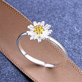 A stunning flower ring featuring gold center, crafted from 18K gold-plated sterling silver.