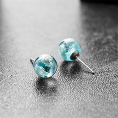 Stylish blue and white cloud ball stud earrings, perfect for enhancing your look with a pop of color.
