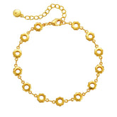 A delicate 18K gold-plated bracelet featuring small circles and a chain, designed with open flower stations.