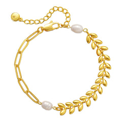 A gold bracelet featuring a leaf charm and pearl beads, elegantly designed with an 18K gold-plated wheat chain.
