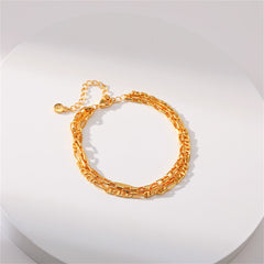 A stylish 18K gold-plated tri-chain bracelet, complete with a clasp and two decorative links.