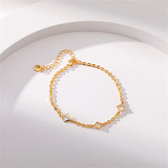 A luxurious gold-plated bracelet with diamond accents and a charming clover design, ideal for special occasions.