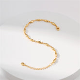 A gold bracelet featuring small oval beads, elegantly designed as an 18K gold-plated olive chain bracelet.