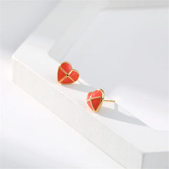 Charming red heart-shaped stud earrings, designed with red enamel and finished in 18K gold plating.