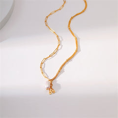 Stylish gold-plated necklace with a pearl pendant, designed with multiple chains for a chic look.
