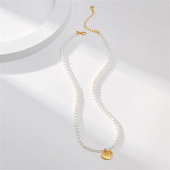 White pearl necklace embellished with a gold heart charm, featuring an exquisite 18K gold-plated 'Love You' pendant.