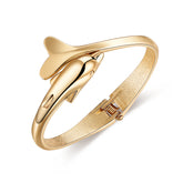 Elegant 18K gold-plated dolphin bracelet, featuring a hinged design for a stylish and comfortable fit.