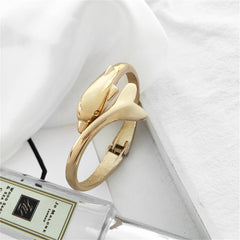 Chic 18K gold-plated dolphin hinged bangle, designed to elevate your accessory game with its unique charm.