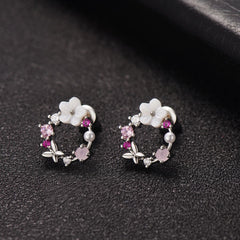 Charming pink flower earrings with white stones, designed with opal and cubic zirconia in a butterfly and floral motif.