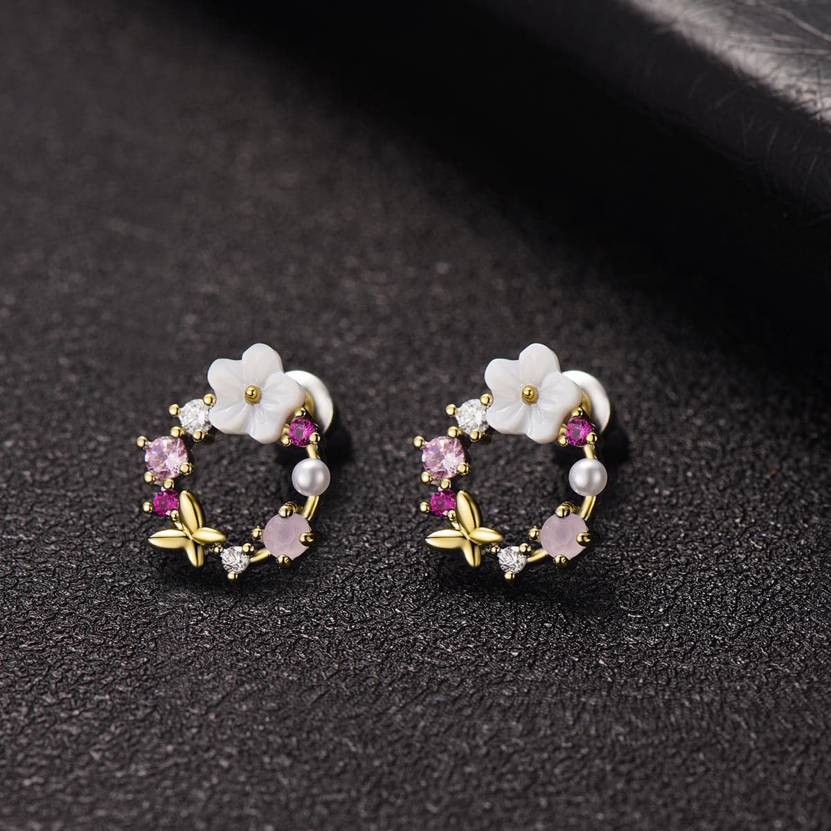 Pink flower earrings with gold plating, featuring opal and cubic zirconia butterfly and floral designs.