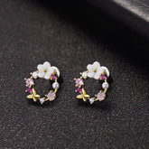 Pink flower earrings with gold plating, featuring opal and cubic zirconia butterfly and floral designs.