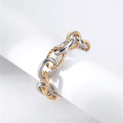 Two-tone bracelet made of interlocked gold and silver twisted chains, designed in an oval shape.