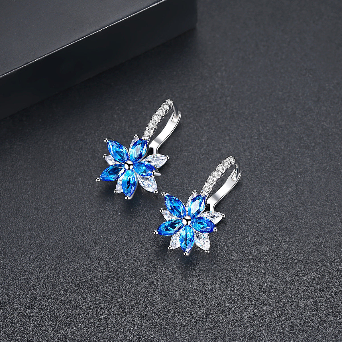 Blue Crystal and Cubic Zirconia Flower Huggie Earrings, huggie earrings, dainty minimalist design, front view
