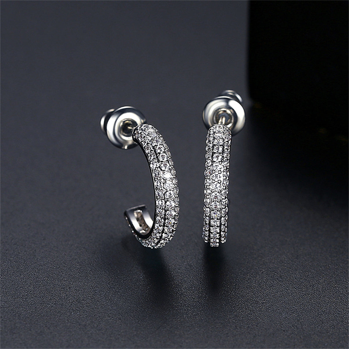 Cubic Zirconia and Silver-Plated Half Circle Huggie Earrings, silver huggie earrings, everyday style, front view