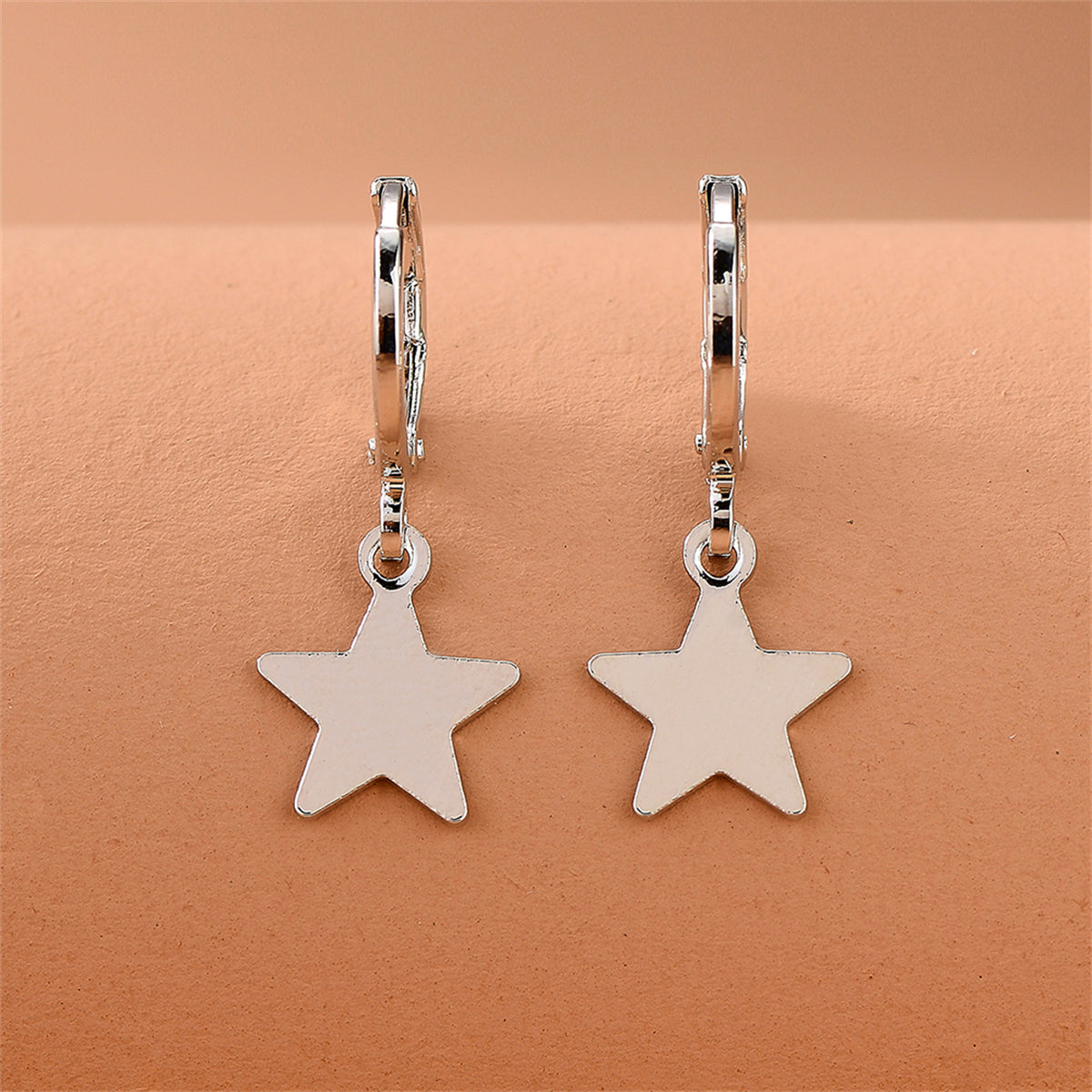 Silver-Plated Star Huggie Earrings, silver huggie earrings, elegant gift for her, lifestyle look