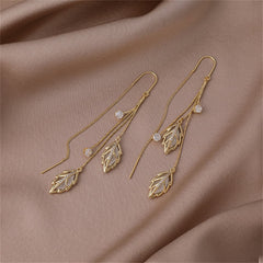 Beautiful gold leaf earrings with sparkling crystal stones, designed as Cats Eye & 18K gold-plated double leaf threaders.