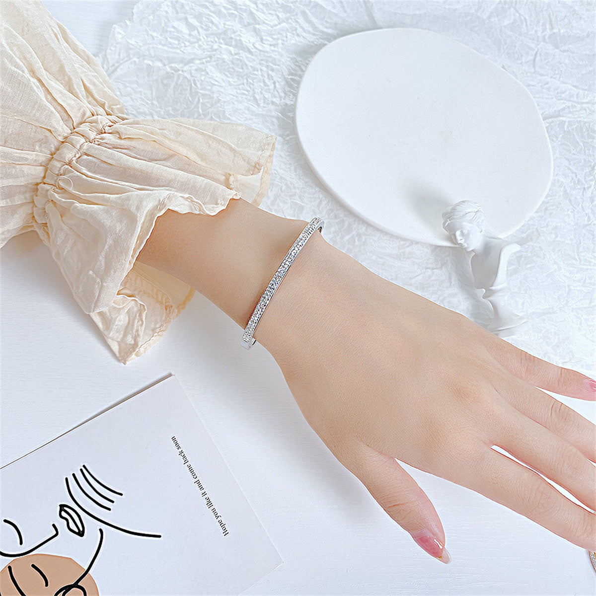 Clear Cubic Zirconia and Silver-Plated Hinged Bangle, silver bangle bracelet, vintage-inspired design, styled look