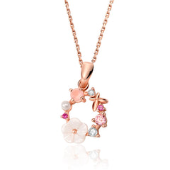 Elegant rose gold necklace with pink floral design and white stones, showcasing a cubic zirconia and pearl pendant.