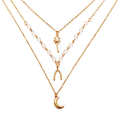 Stunning 18K gold plated layered necklaces showcasing a star, moon, and star, perfect for adding a celestial touch.