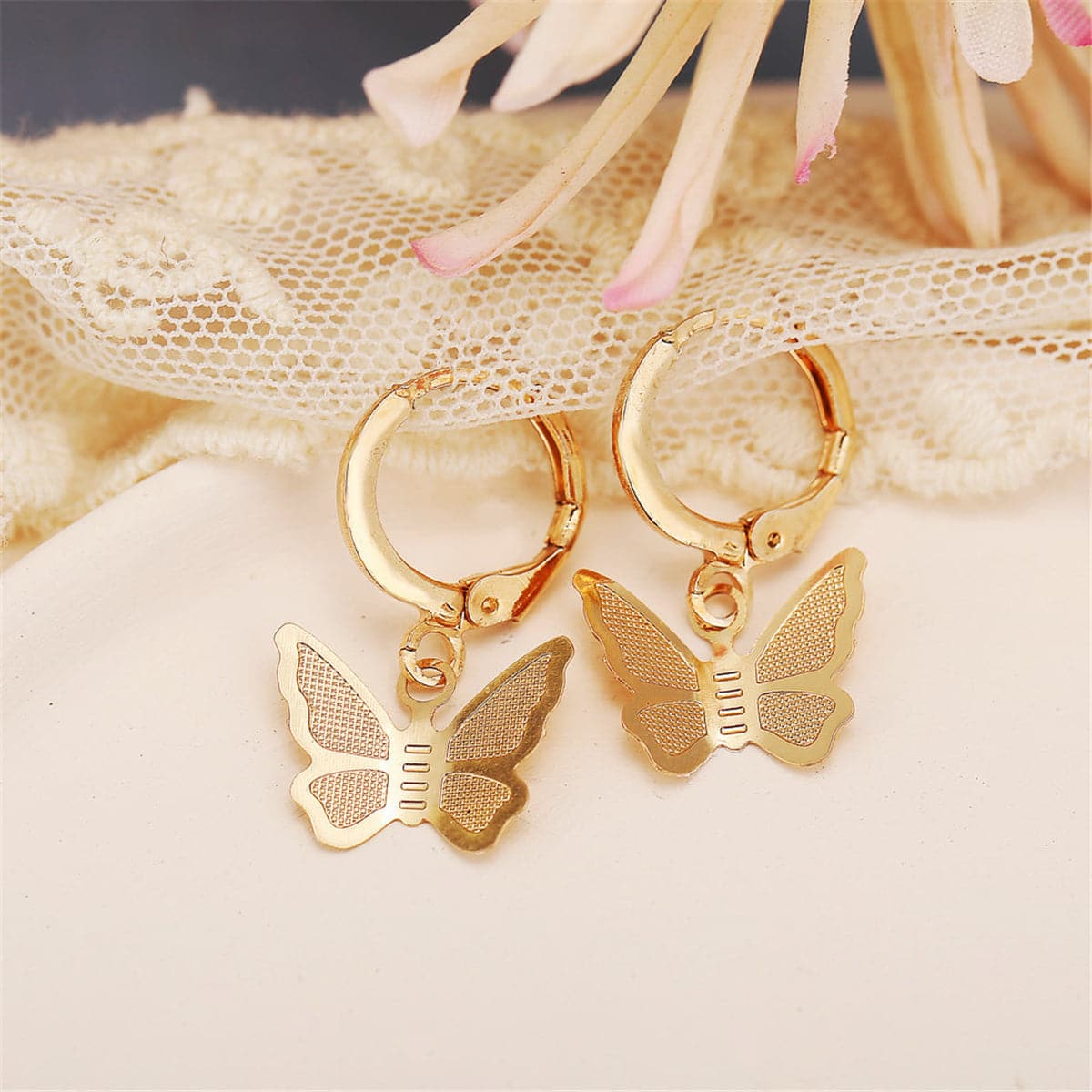 Elegant 18K gold-plated butterfly drop earrings, perfect for adding a touch of charm to any outfit.