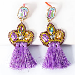 Beautiful purple tassel drop earrings, decorated with shimmering crystals and beads for a glamorous touch.