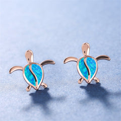 Elegant blue opal turtle stud earrings in 18K rose gold, showcasing a unique and playful accessory for turtle lovers.