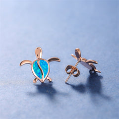 Stunning blue opal turtle earrings in rose gold, combining elegance and fun for a stylish accessory choice.