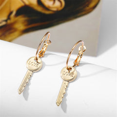 Elegant 18K gold-plated 'Love' key drop earrings, perfect for adding a touch of romance to any outfit.