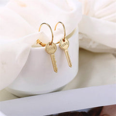 Dazzling 18K gold-plated 'Love' key earrings, a fashionable statement piece that embodies love and sophistication.