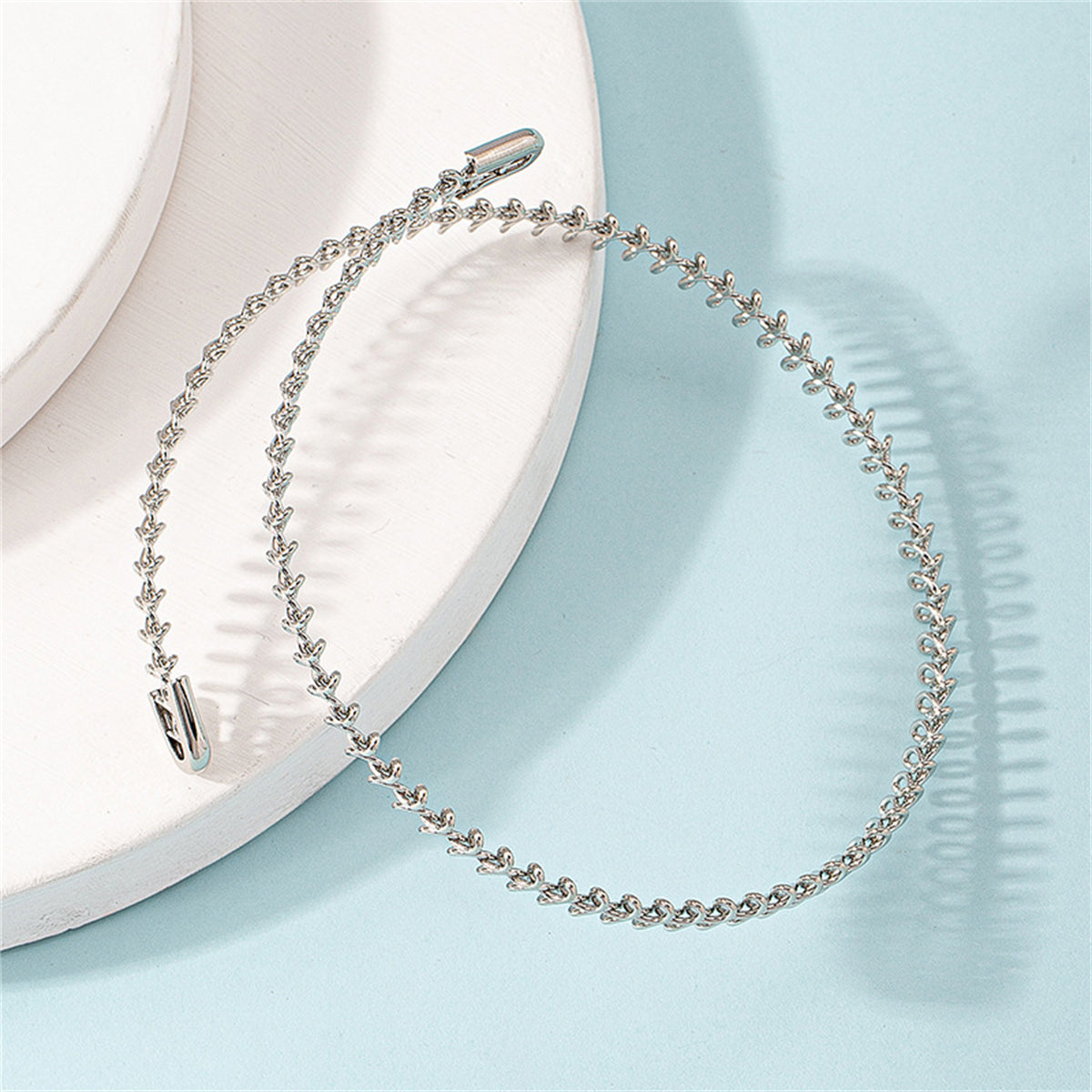 Silver-Plated Fishbone Choker Necklace, chunky silver choker necklace, vintage-inspired design, lifestyle look