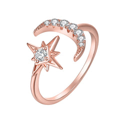 Elegant rose gold-plated ring with a star and moon motif, embellished with shimmering cubic zirconia stones.