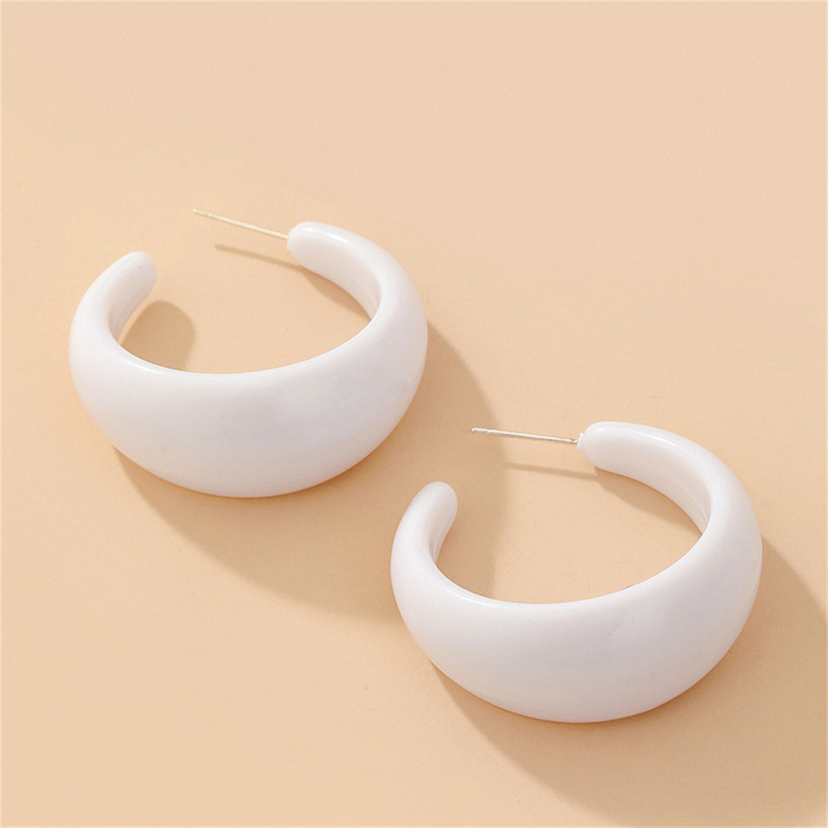 White Resin and Silver-Plated Chunky C-Shaped Huggie Earrings, silver huggie earrings, botanical inspired, detail close-up