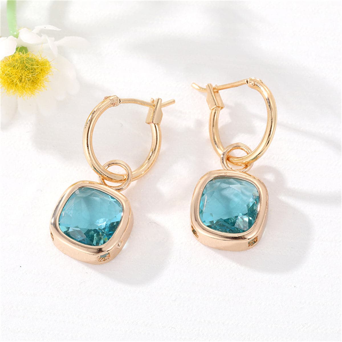 Lake Blue Crystal and 18K Gold-Plated Cube Huggie Earring, gold huggie earrings, dainty minimalist design, front view