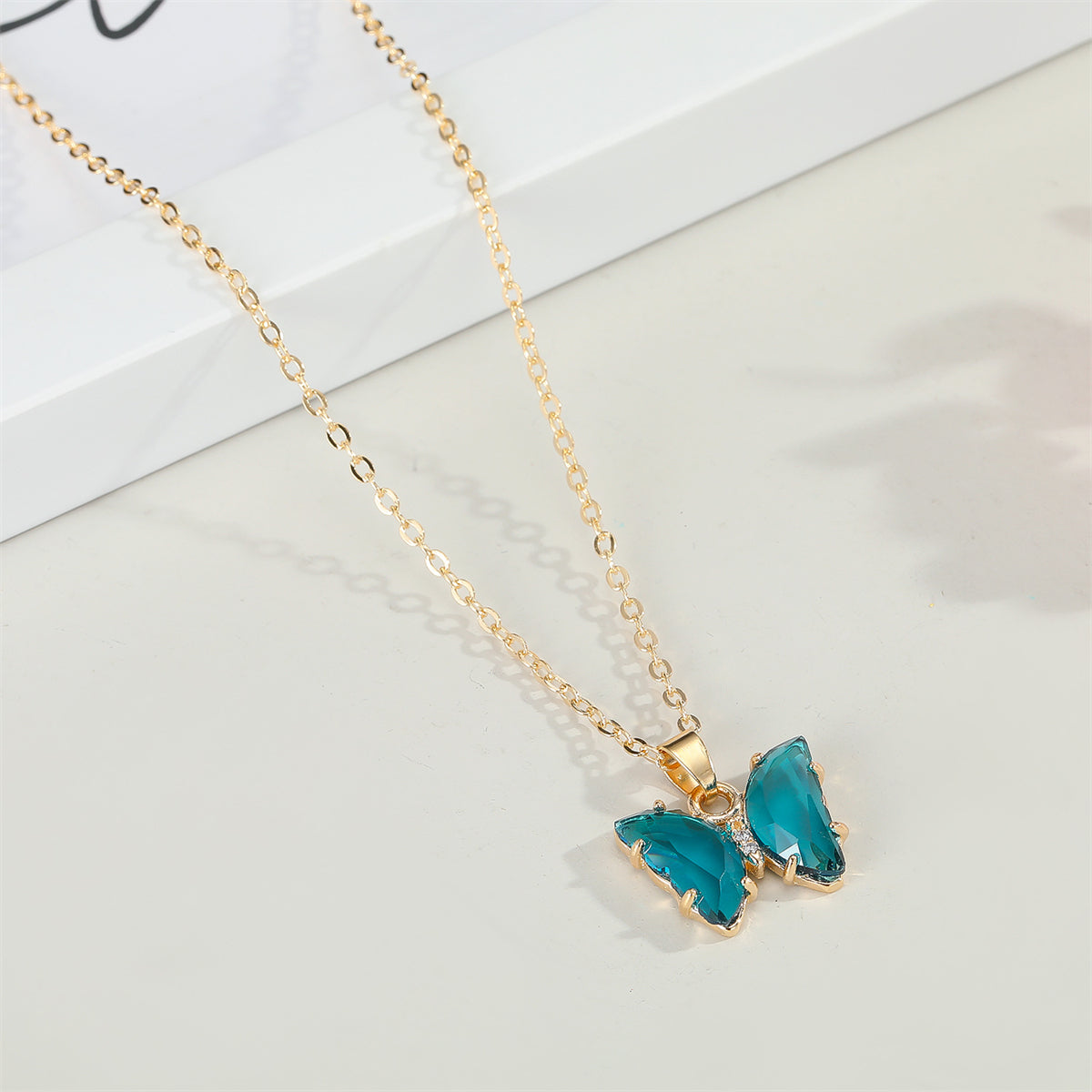 Blue Crystal and Cubic Zirconia Butterfly Pendant Necklace, pendant necklace for women, vintage-inspired design, front view