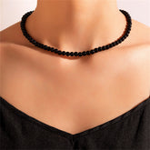 Black quartz beaded choker necklace featuring a sleek silver clasp.