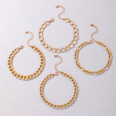 Four stylish gold chain anklets, featuring an exquisite 18K gold-plated curb chain design for a fashionable flair.