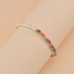 A stylish anklet made of multicolor Howlite beads and pearls, offering a vibrant and elegant accessory for any outfit.