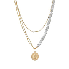A sophisticated necklace with a layered design, featuring an 18K gold-plated coin pendant and a beautiful pearl chain.