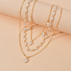 Exquisite three-strand pearl necklace complemented by 18K gold-plated layers, ideal for enhancing any outfit's elegance.