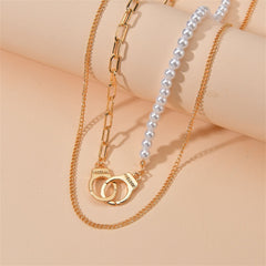 A sophisticated combination of a pearl necklace and a gold chain, highlighted by an 18K gold-plated handcuff pendant.