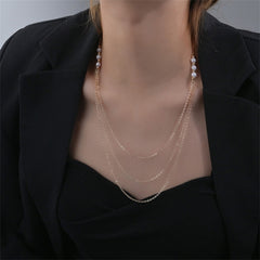 Elegant 18K gold-plated necklace adorned with three rows of diamonds and pearls, showcasing a luxurious design.