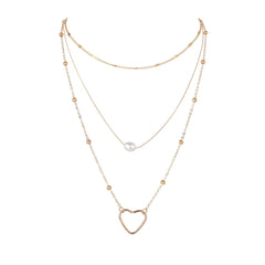An elegant necklace featuring a heart pendant in 18K gold plating, complemented by a delicate pearl.