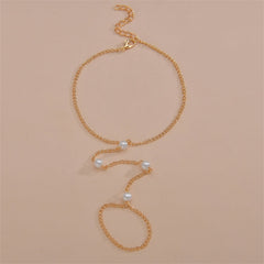 Elegant gold chain anklet featuring pearls, perfect for adding a touch of luxury to any outfit.